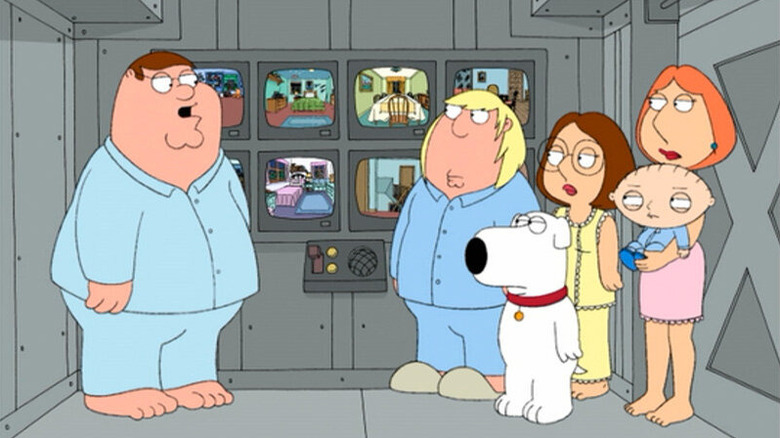 The Griffins, wearing pajamas, looking at video monitors in their panic room. An episode of Family Guy.