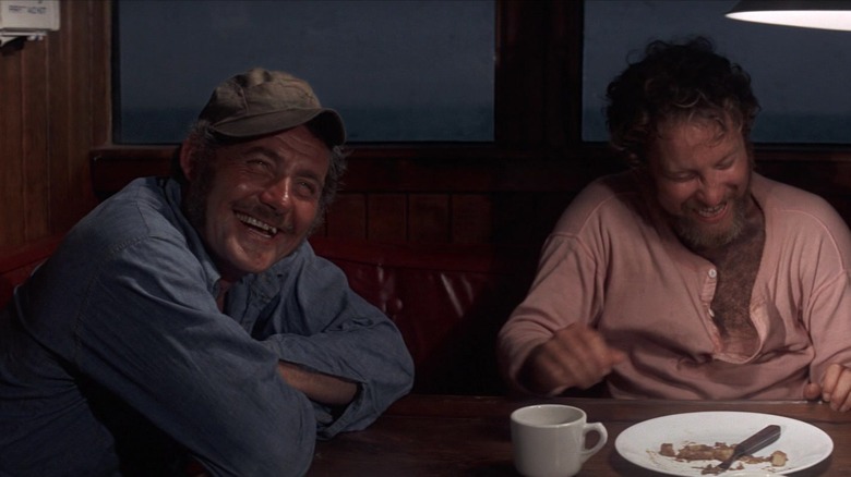 Quint and Hooper smiling and laughing in Jaws