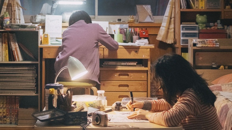 Fujino and Kyomoto drawing a manga in the live-action Look Back